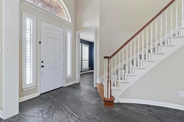 a view of entryway with wooden floor