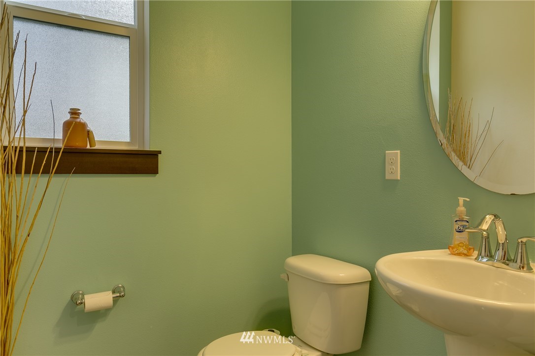17627 3rd Avenue Southeast Bothell, WA 98012 - Photo 22 of 37 a bathroom with a toilet sink and mirror