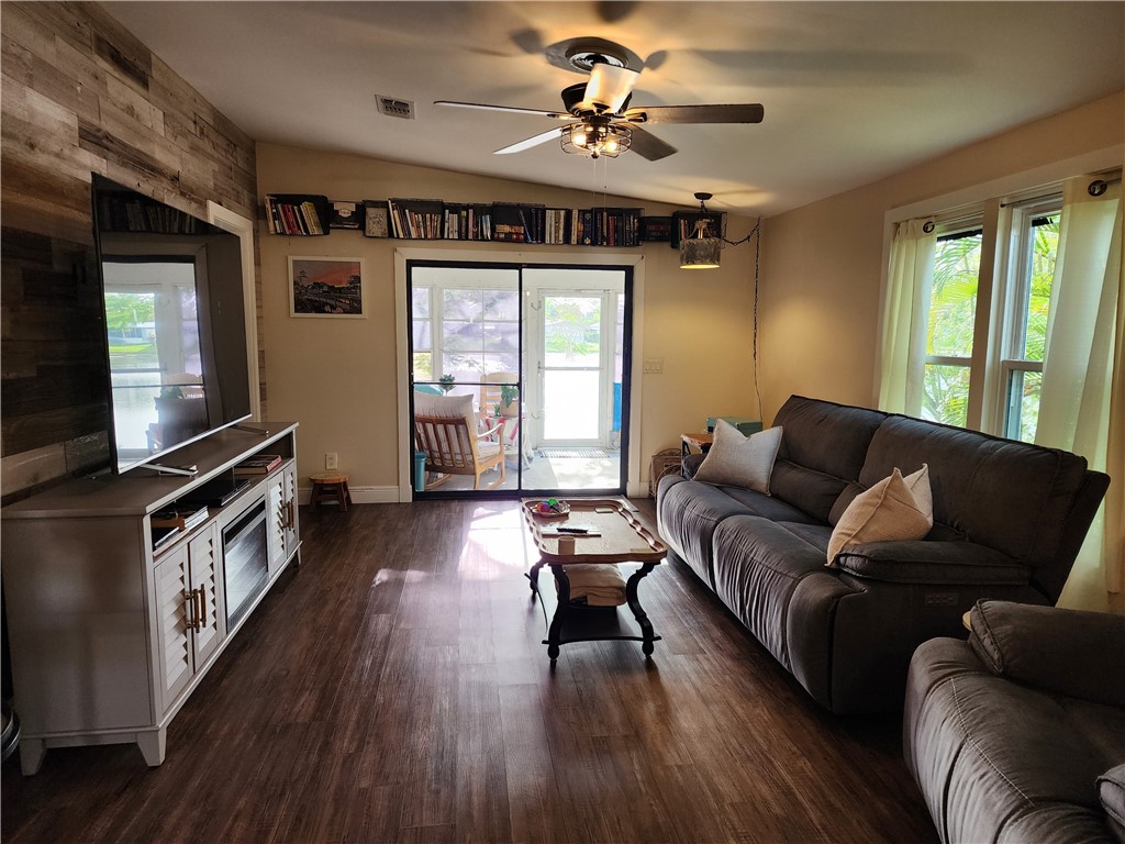 256 Bimini Cay Circle Vero Beach, FL 32966 - Photo 12 of 35 a living room with furniture and a flat screen tv