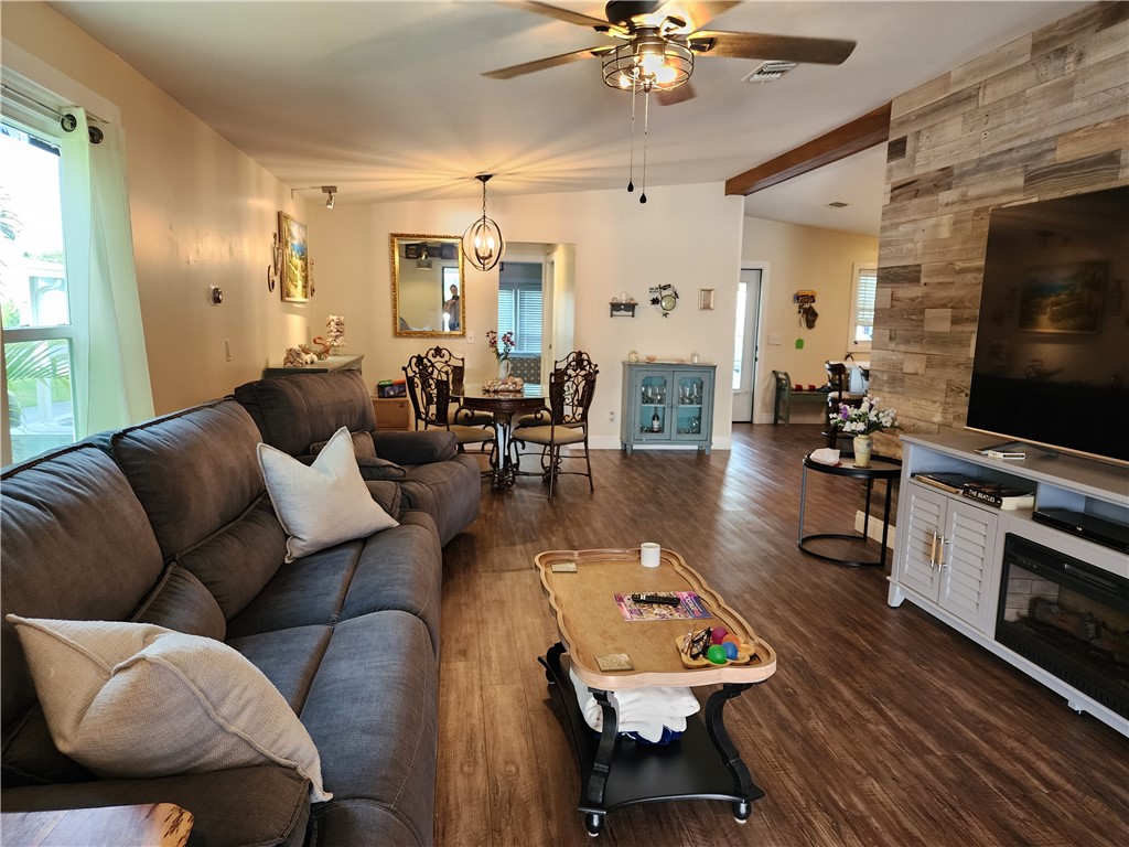 256 Bimini Cay Circle Vero Beach, FL 32966 - Photo 13 of 35 a living room with furniture kitchen view and a flat screen tv