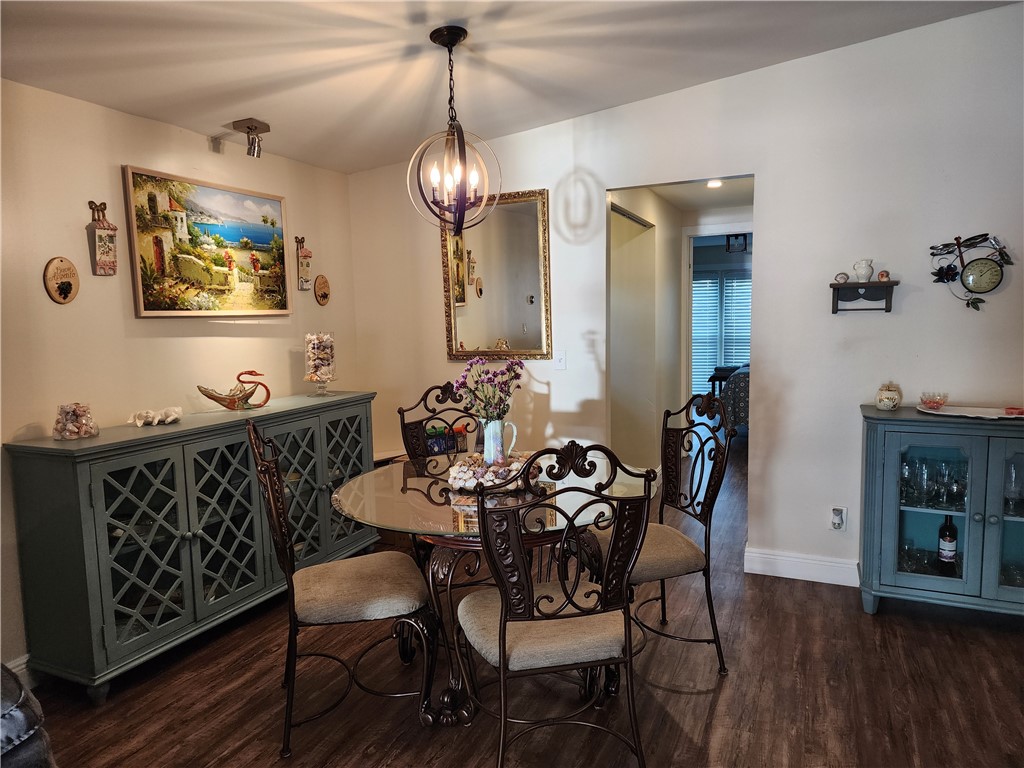 256 Bimini Cay Circle Vero Beach, FL 32966 - Photo 16 of 35 a view of a dining room with furniture wooden floor and chandelier