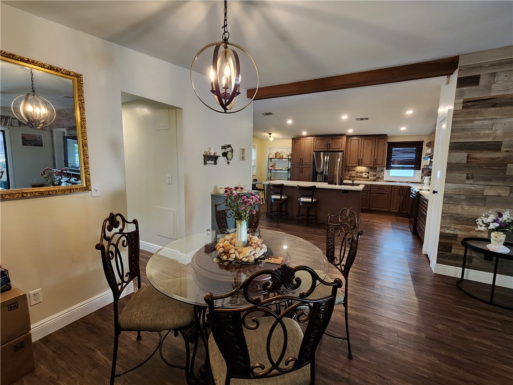 256 Bimini Cay Circle Vero Beach, FL 32966 - Photo 17 of 35 a view of a dining room with furniture wooden floor and chandelier