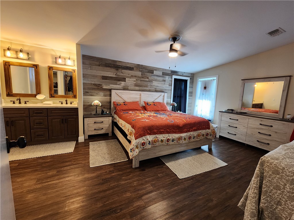 256 Bimini Cay Circle Vero Beach, FL 32966 - Photo 18 of 35 a bedroom with a bed and a desk