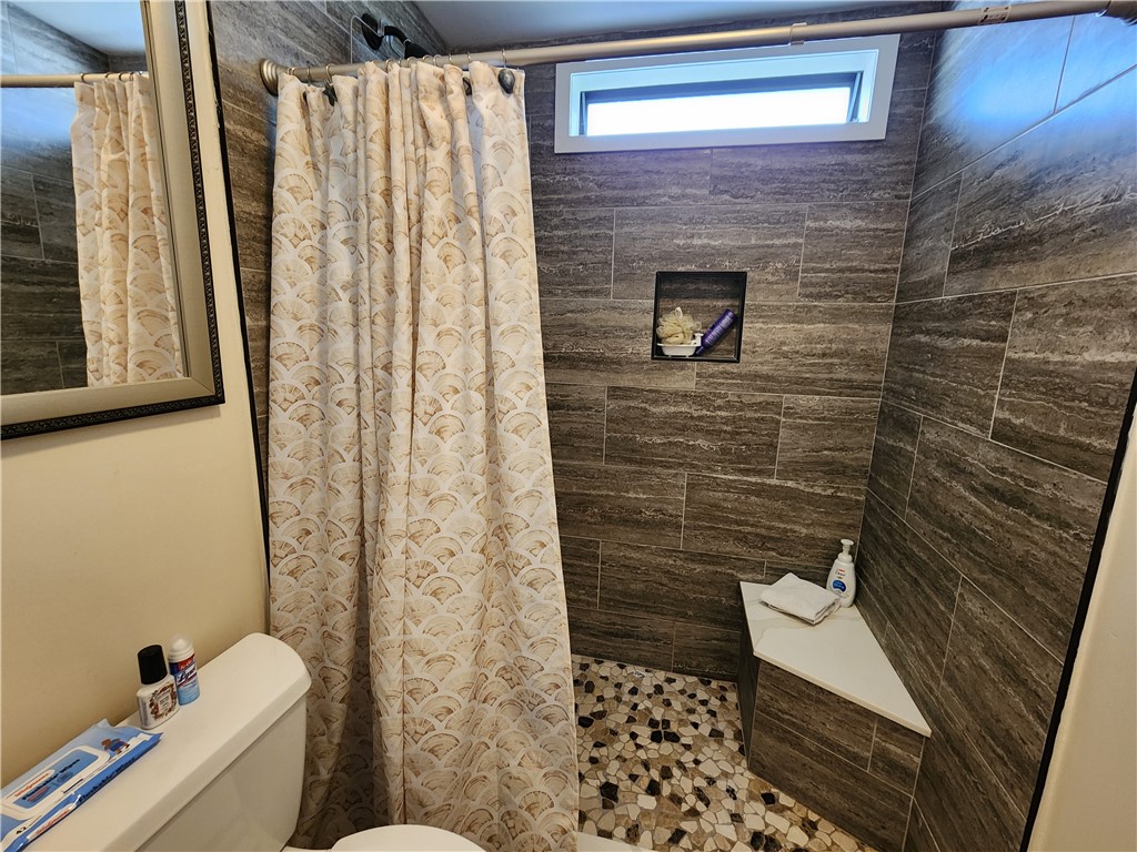 256 Bimini Cay Circle Vero Beach, FL 32966 - Photo 22 of 35 a bathroom with a toilet and a shower
