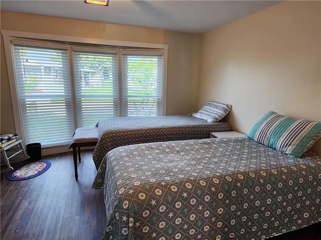 256 Bimini Cay Circle Vero Beach, FL 32966 - Photo 26 of 35 a bedroom with a bed and a dresser next to a window