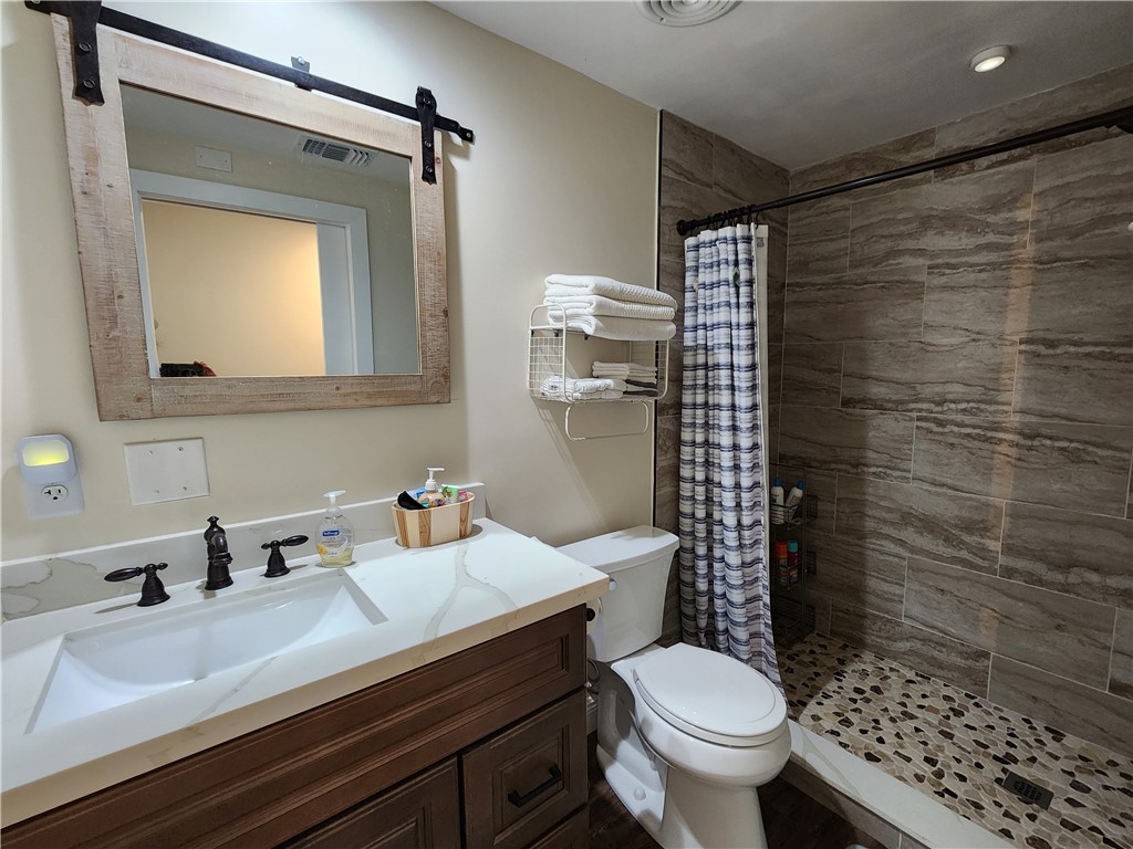 256 Bimini Cay Circle Vero Beach, FL 32966 - Photo 27 of 35 a bathroom with a sink toilet and shower