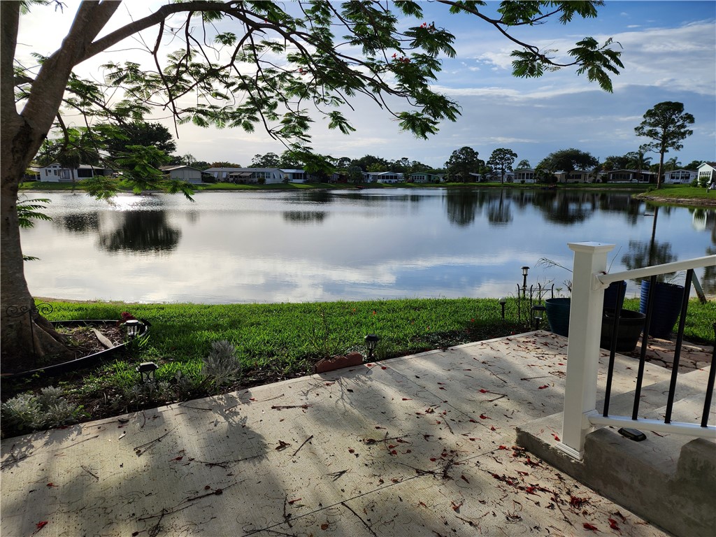 256 Bimini Cay Circle Vero Beach, FL 32966 - Photo 32 of 35 a view of a lake with houses