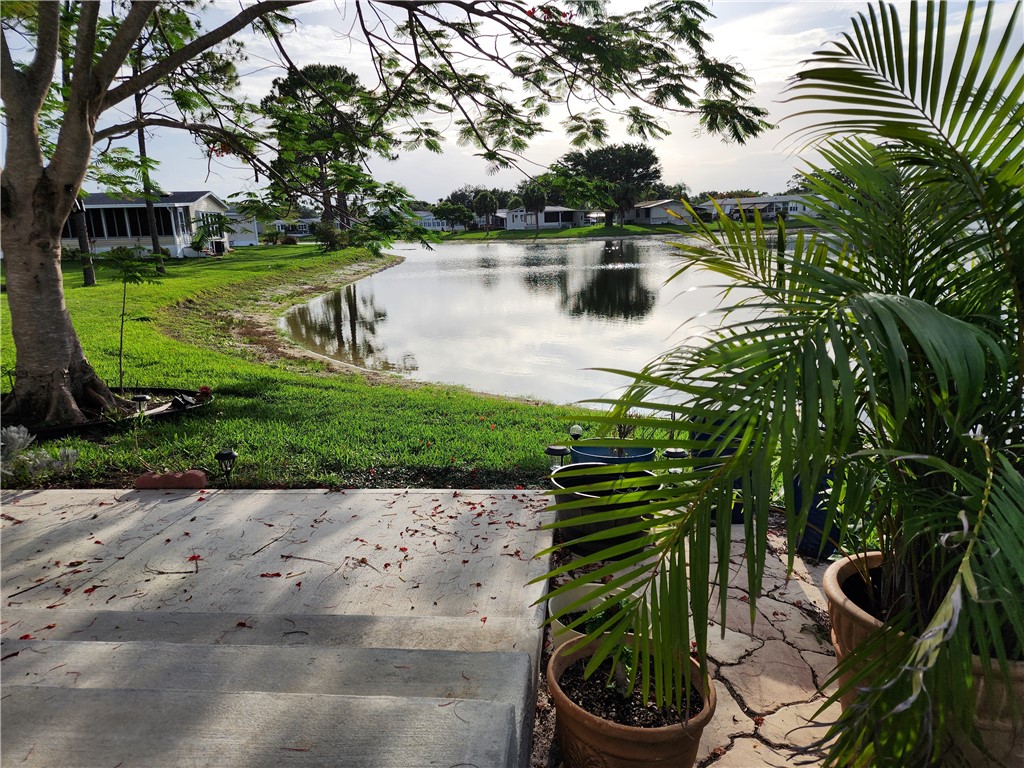 256 Bimini Cay Circle Vero Beach, FL 32966 - Photo 33 of 35 a lake view with a garden