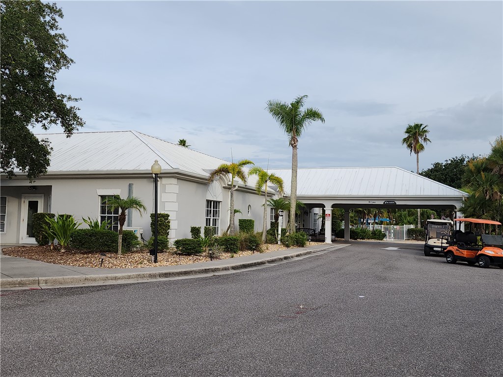 256 Bimini Cay Circle Vero Beach, FL 32966 - Photo 35 of 35 a couple of cars parked in front of a building