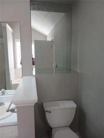 a bathroom with a toilet and a sink