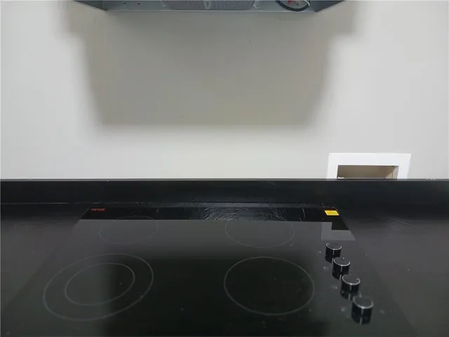 a kitchen with stainless steel appliances a sink a stove and a refrigerator