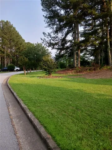 a view of living room with a fireplace and stairs
