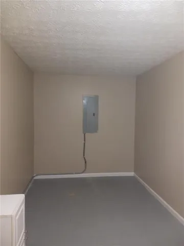 a view of an empty room and a window