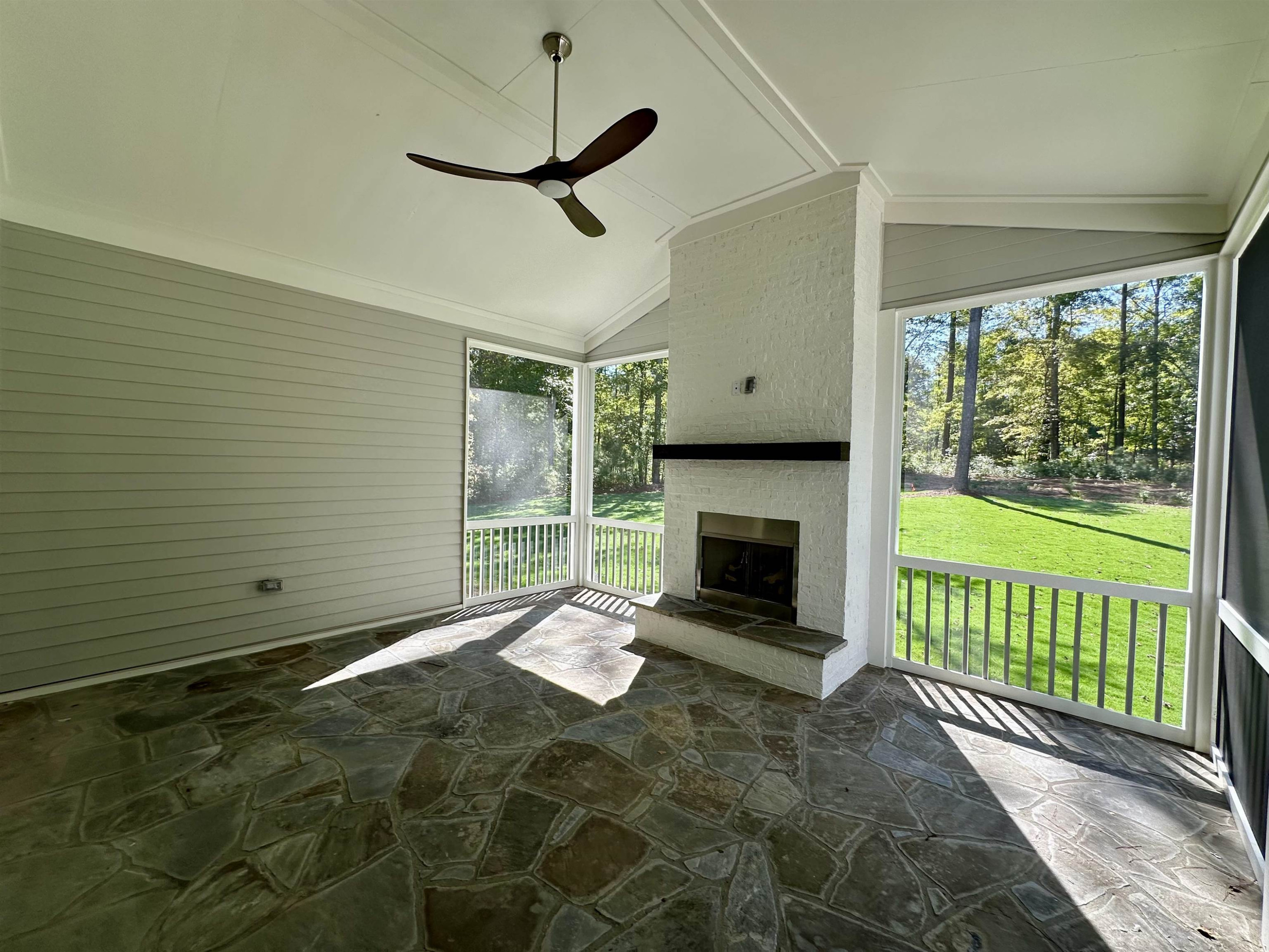 1413 Starry Night Court Raleigh, NC 27613 - Photo 22 of 30 a view of an empty room with a fireplace and a window