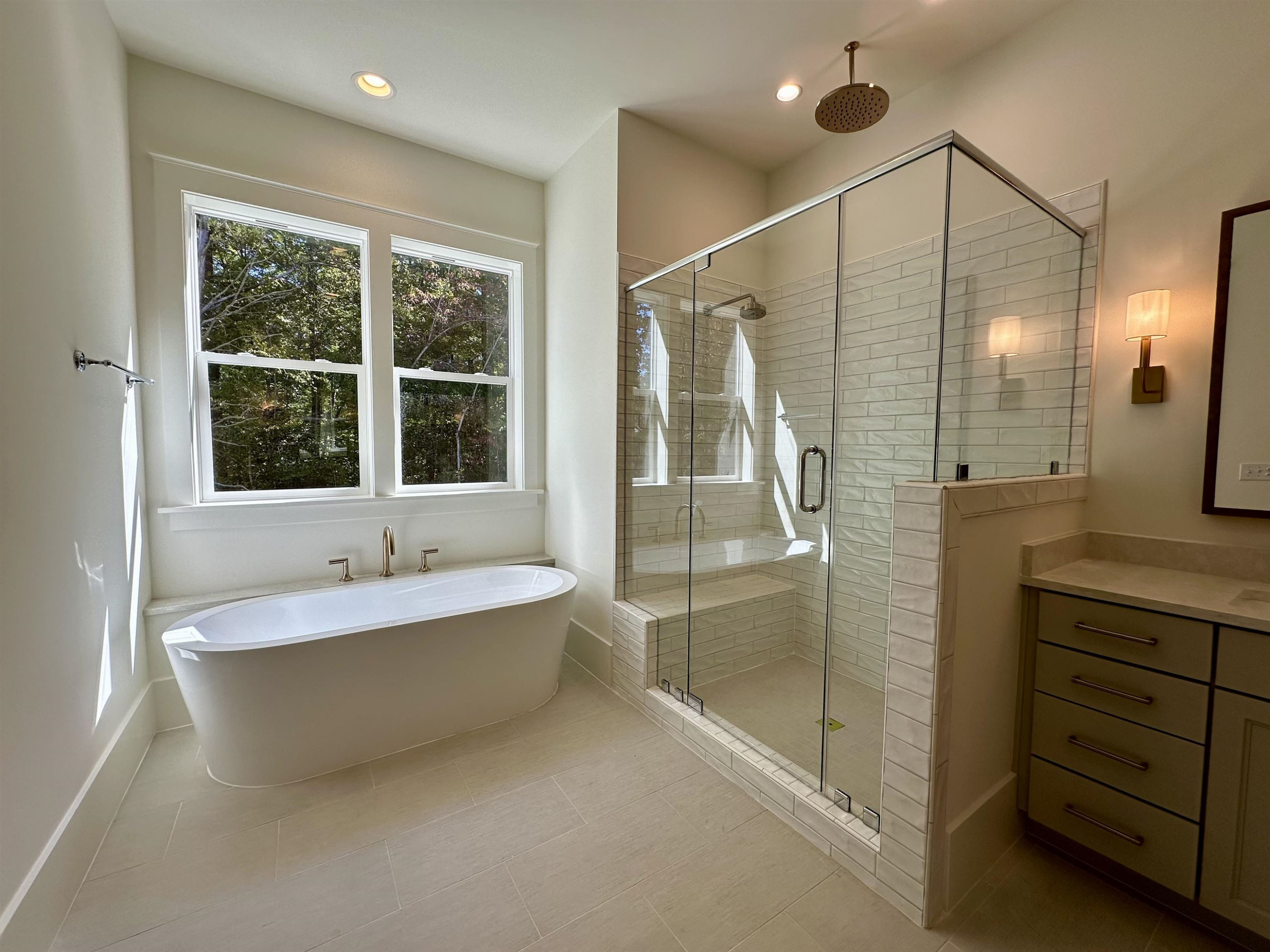 1413 Starry Night Court Raleigh, NC 27613 - Photo 25 of 30 a bathroom with a tub sink shower and mirror