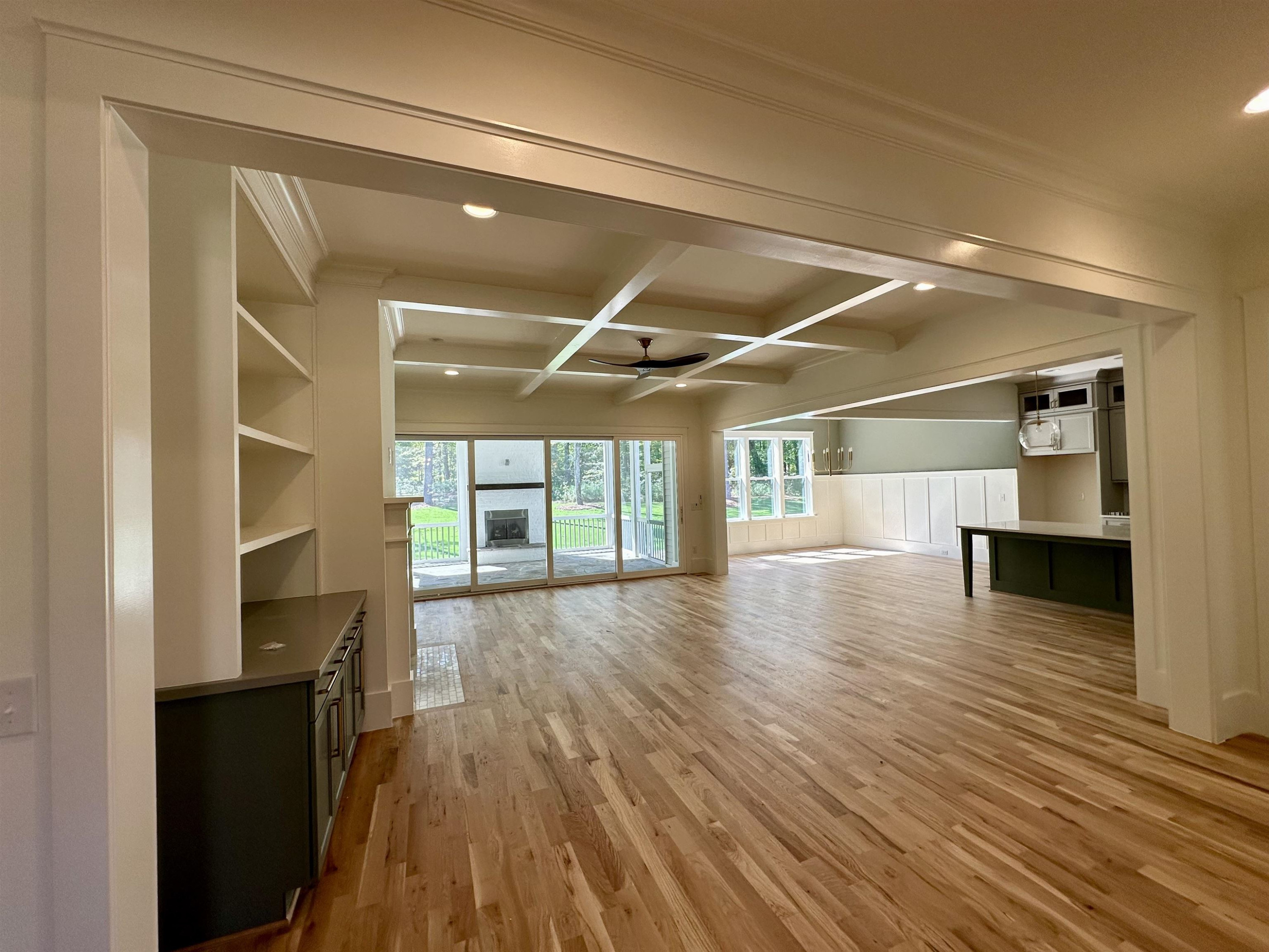 1413 Starry Night Court Raleigh, NC 27613 - Photo 7 of 30 a view of empty room with wooden floor and fireplace