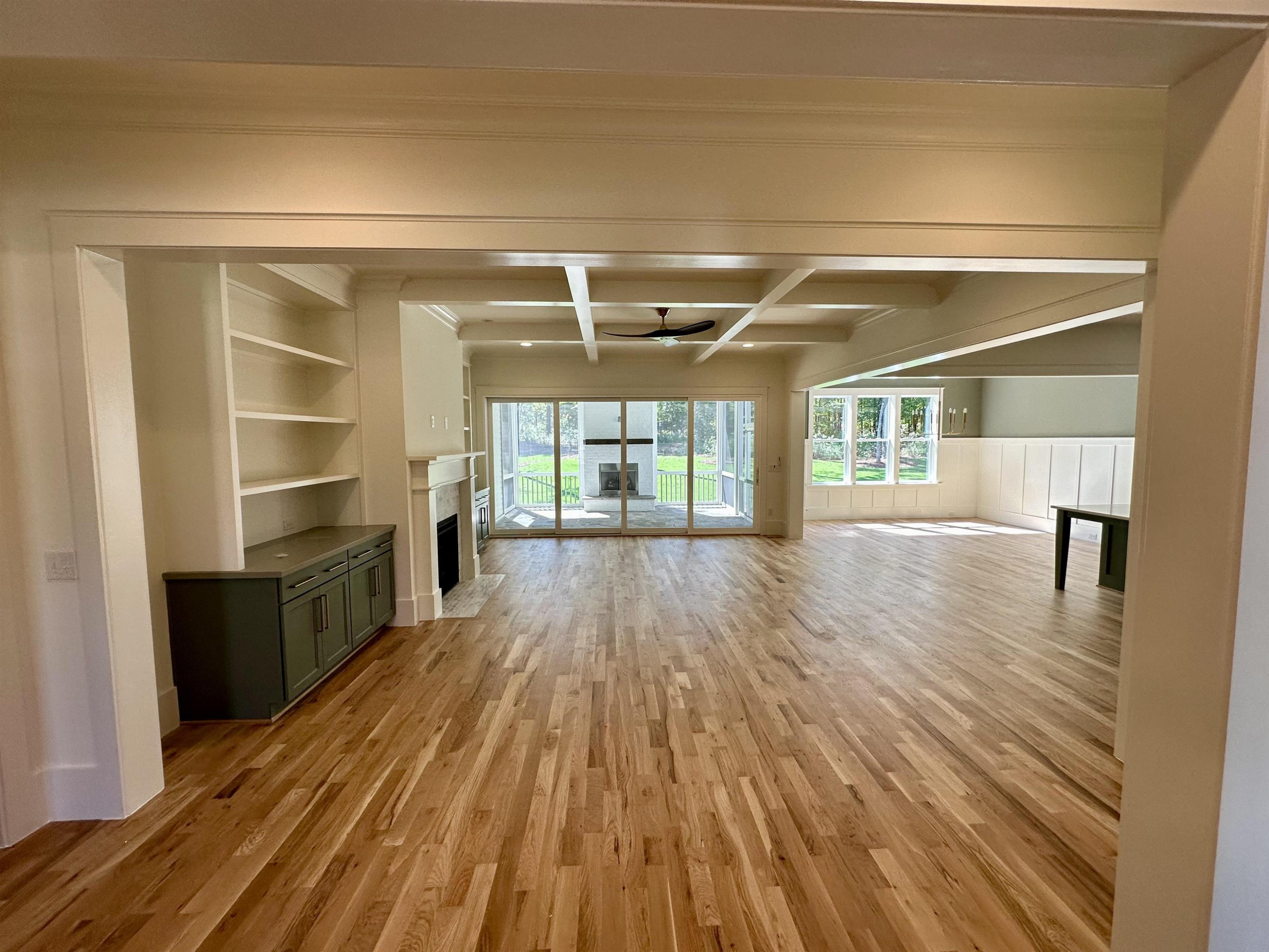 1413 Starry Night Court Raleigh, NC 27613 - Photo 8 of 30 wooden floor in an empty room with a window