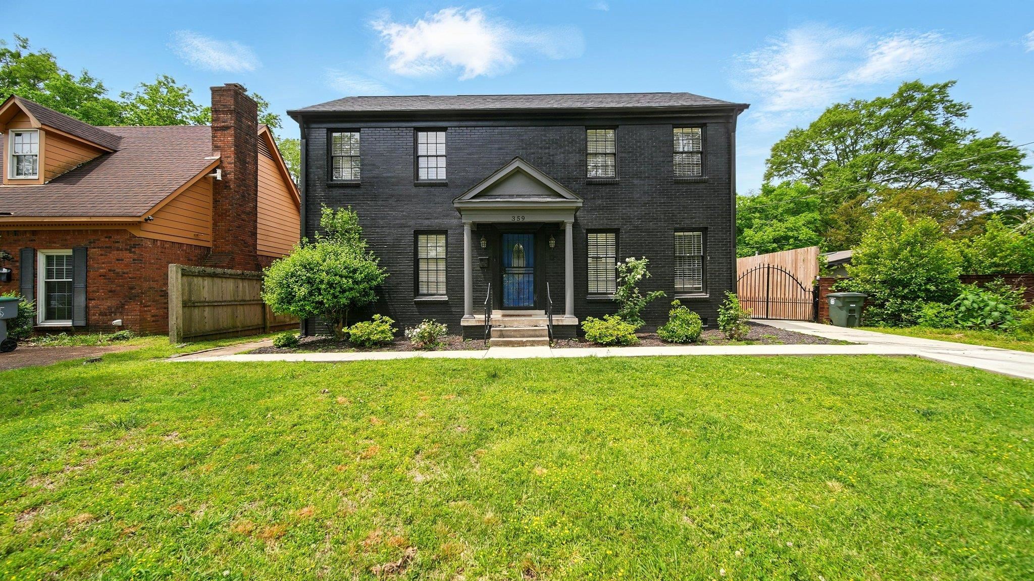 359 South Fenwick Road Memphis, TN 38111 - Photo 1 of 31 Colonial house featuring a gate, brick siding, and a chimney