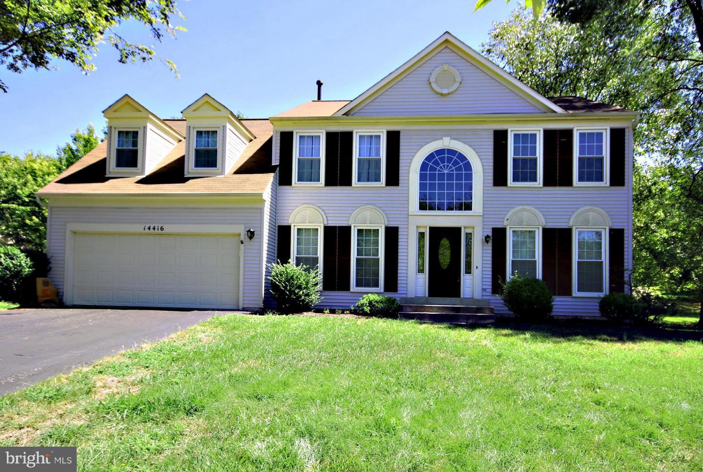 14416 Old Stage Road Bowie, MD 20720 - Photo 1 of 24 a front view of a house with garden