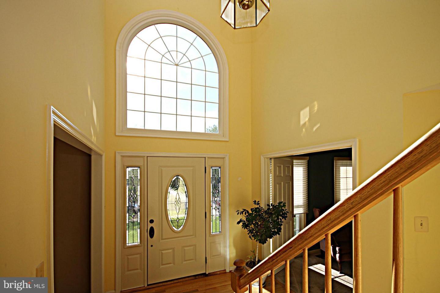 14416 Old Stage Road Bowie, MD 20720 - Photo 2 of 24 a view of an entryway with wooden floor and windows