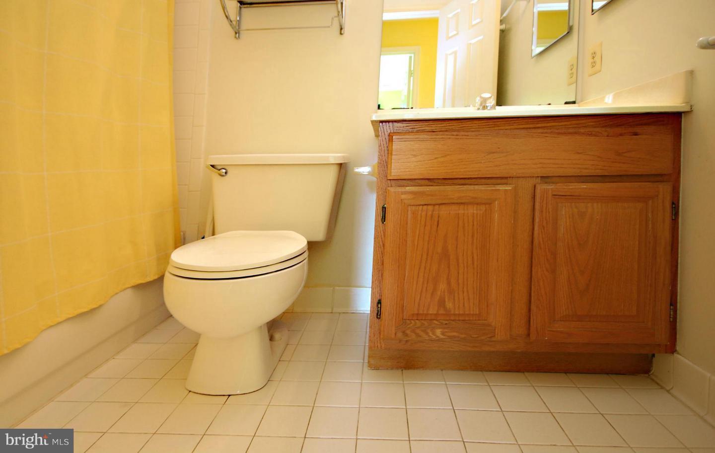 14416 Old Stage Road Bowie, MD 20720 - Photo 15 of 24 a bathroom with a sink and a toilet