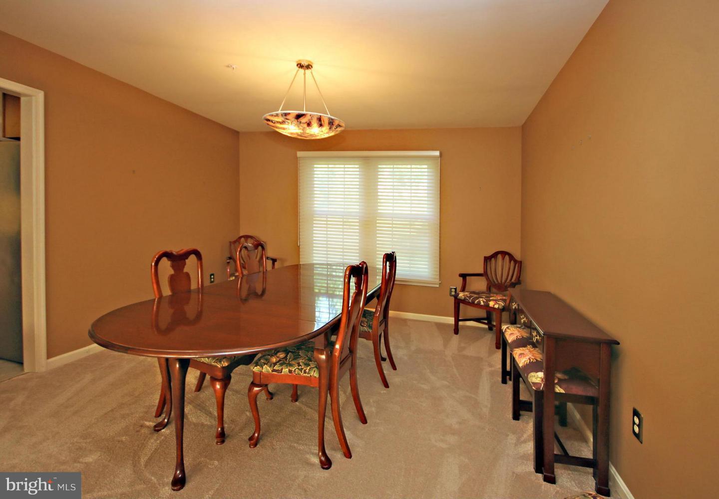 14416 Old Stage Road Bowie, MD 20720 - Photo 22 of 24 a view of a dining room with furniture and window
