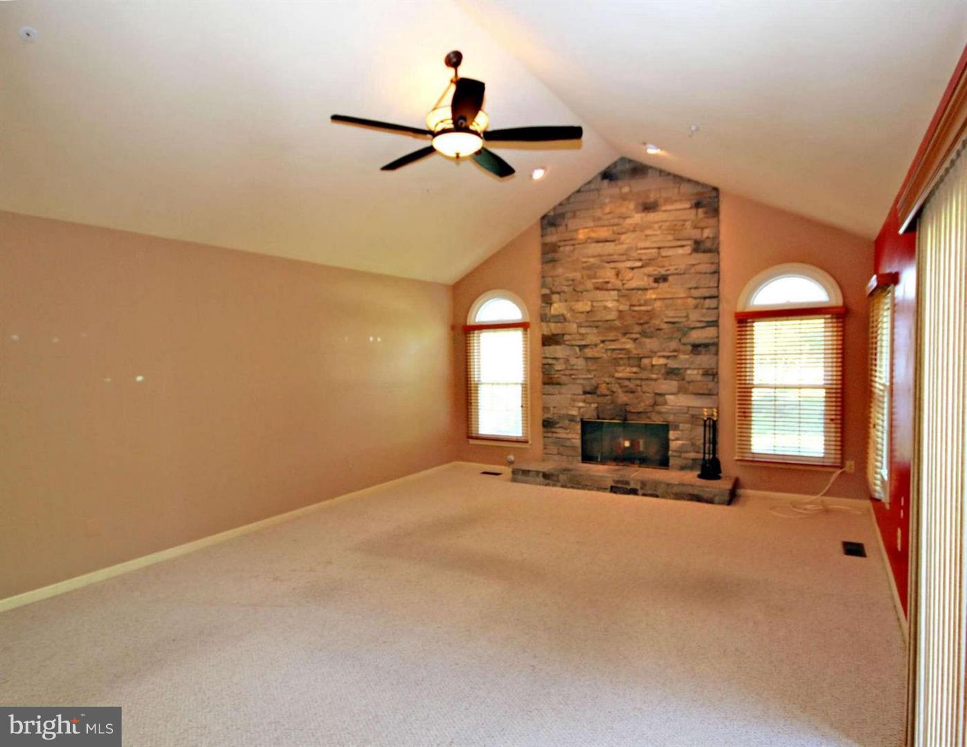 14416 Old Stage Road Bowie, MD 20720 - Photo 7 of 24 a view of a livingroom with a ceiling fan and window