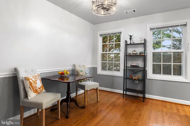 a reading room with furniture and a window