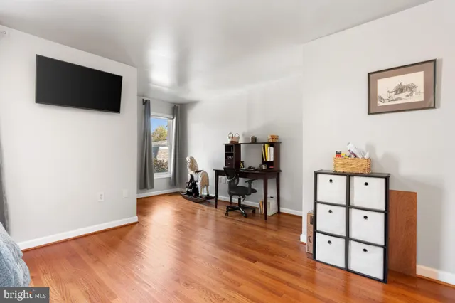 a view of a livingroom with furniture and a flat screen tv