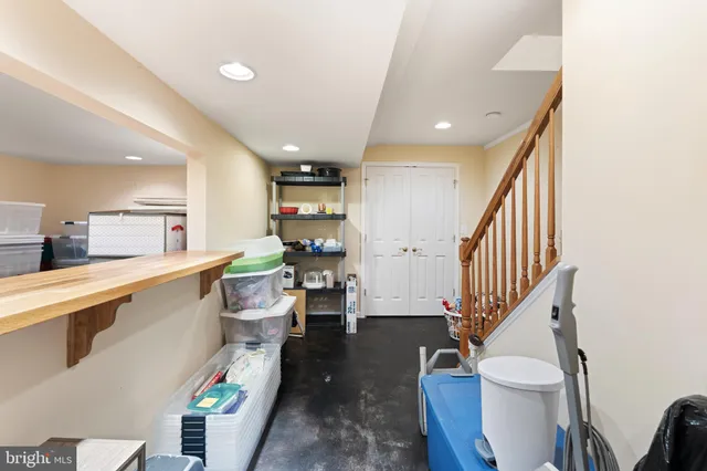 a kitchen with a table and chairs