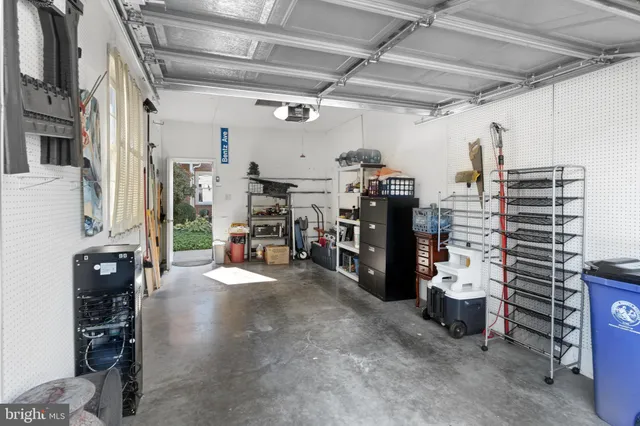 a view of a storage room with water heater and racks