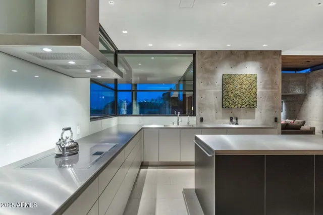 a view of a dining room with furniture and a chandelier
