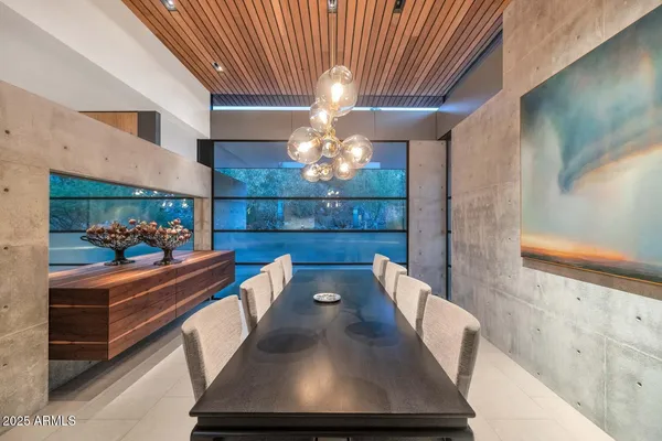 a view of a dining room with furniture and window