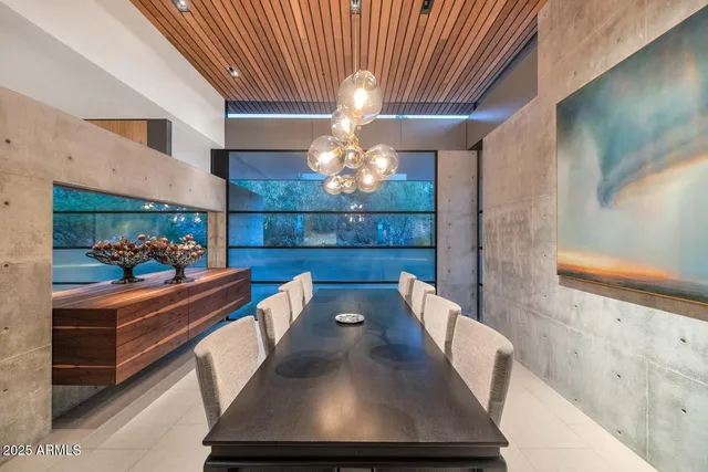 a view of a dining room with furniture and window
