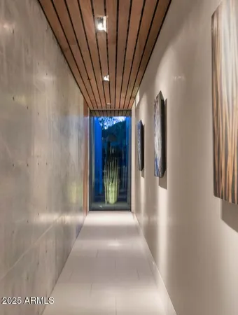 a bedroom with a bed and a television