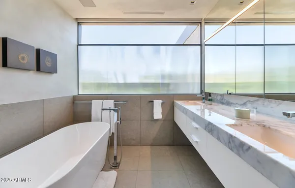a bathroom with a bathtub and shower