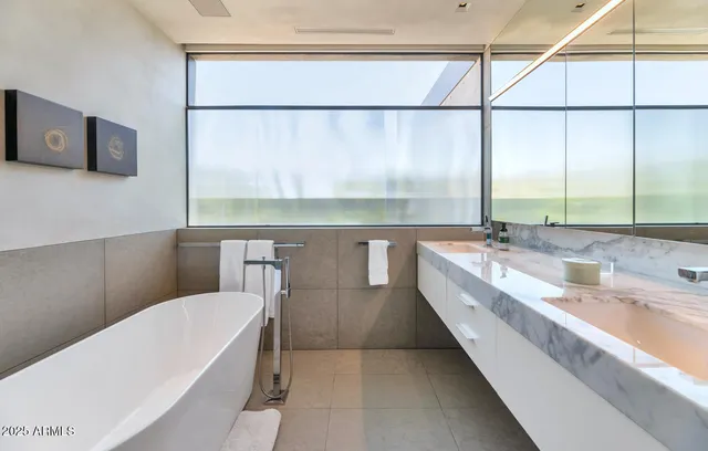 a bathroom with a bathtub and shower