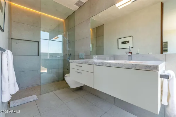 a balcony with table and chairs