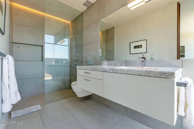 a balcony with table and chairs