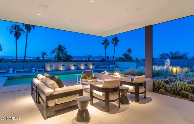 a living room with furniture and large window