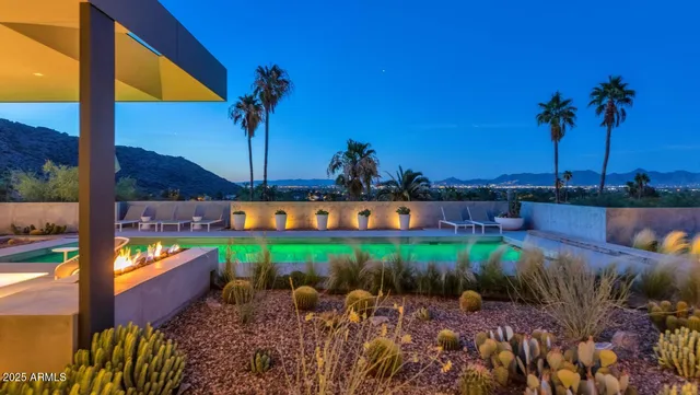 a view of swimming pool with outdoor seating
