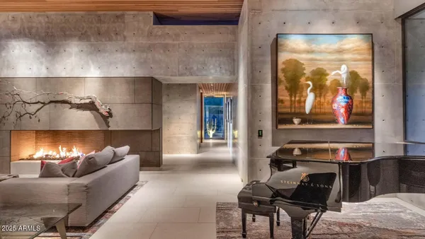 a living room with furniture a rug and a window