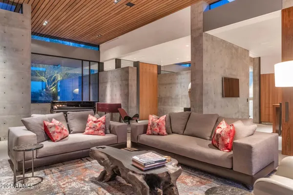 a living room with furniture and a fireplace