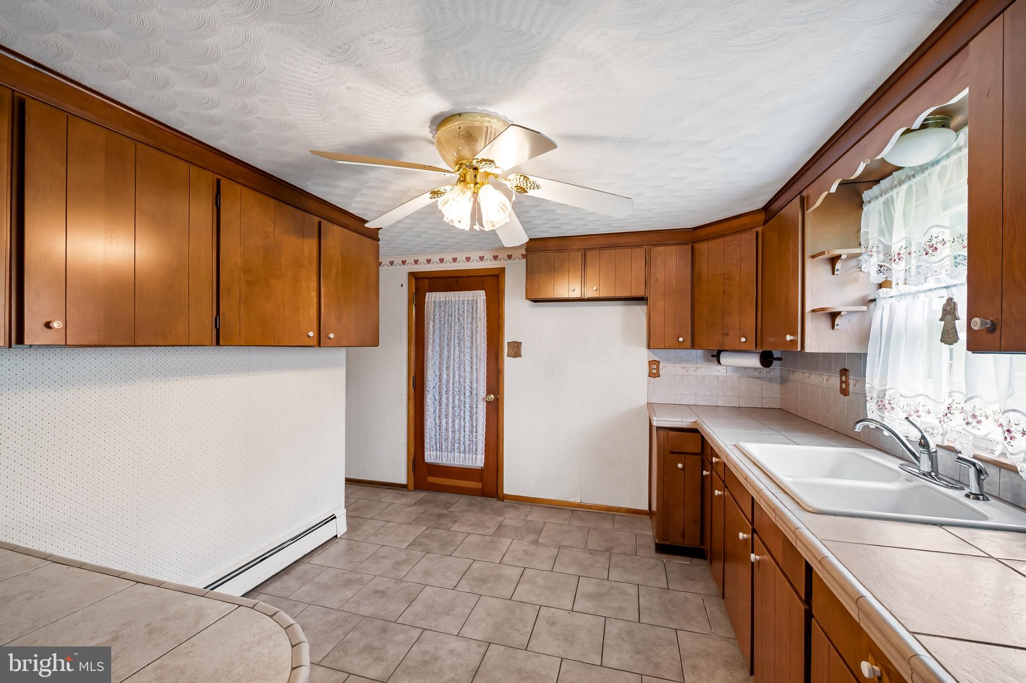 2100 Peterman Road Freeland, MD 21053 - Photo 14 of 36 Cozy kitchen with warm wood accents.