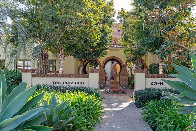 a view of a bench and chairs in the terrace