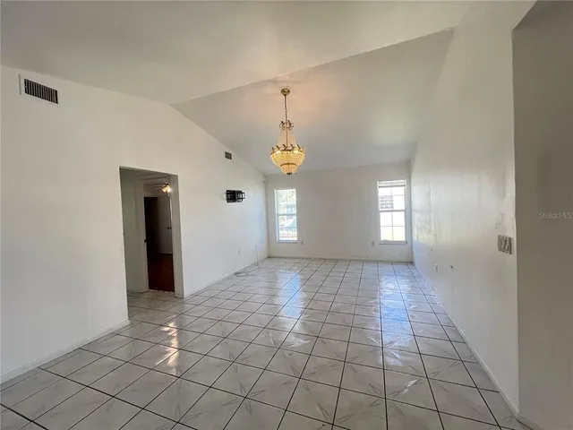 a view of an empty room and window