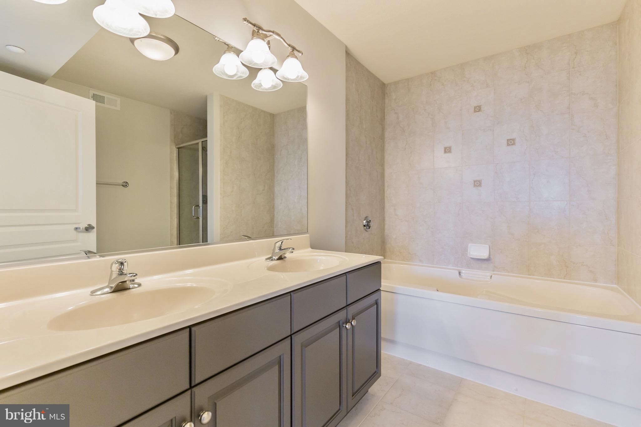 8501 Bayside Road, Unit PH2 Chesapeake Beach, MD 20732 - Photo 17 of 30 Ensuite With Dual Vanities, Sep. Tub And Shower