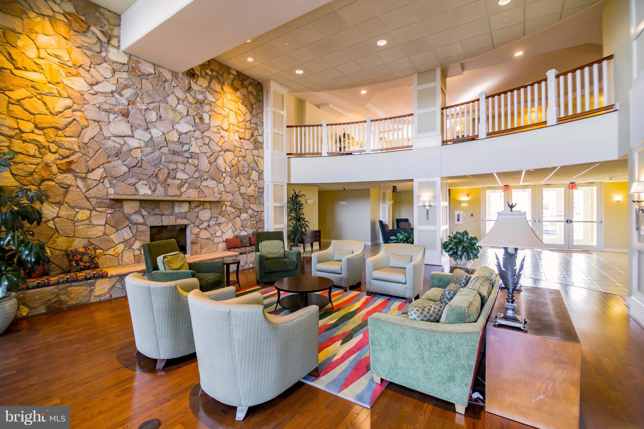 8501 Bayside Road, Unit PH2 Chesapeake Beach, MD 20732 - Photo 23 of 30 Gorgeous Two Story Lobby With Stone Fireplace