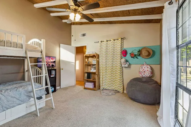 a view of hall way with furniture