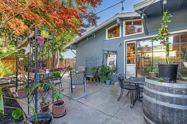 a view of outdoor sitting area with furniture and garden